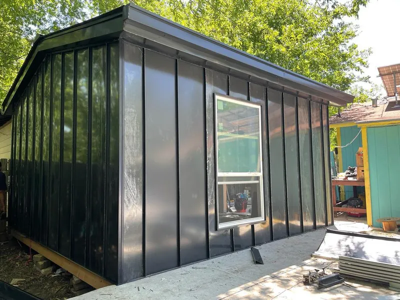 Black standing seam metal wall panels for Roof Inspection in Pelican Bay